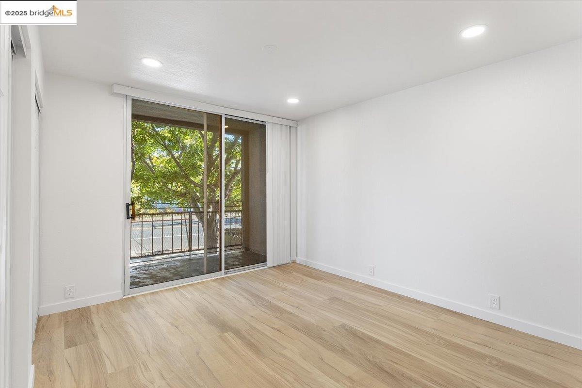 1610 Milvia Street Berkeley, CA 94709 - Photo 12 of 24 a view of empty room with wooden floor and fan
