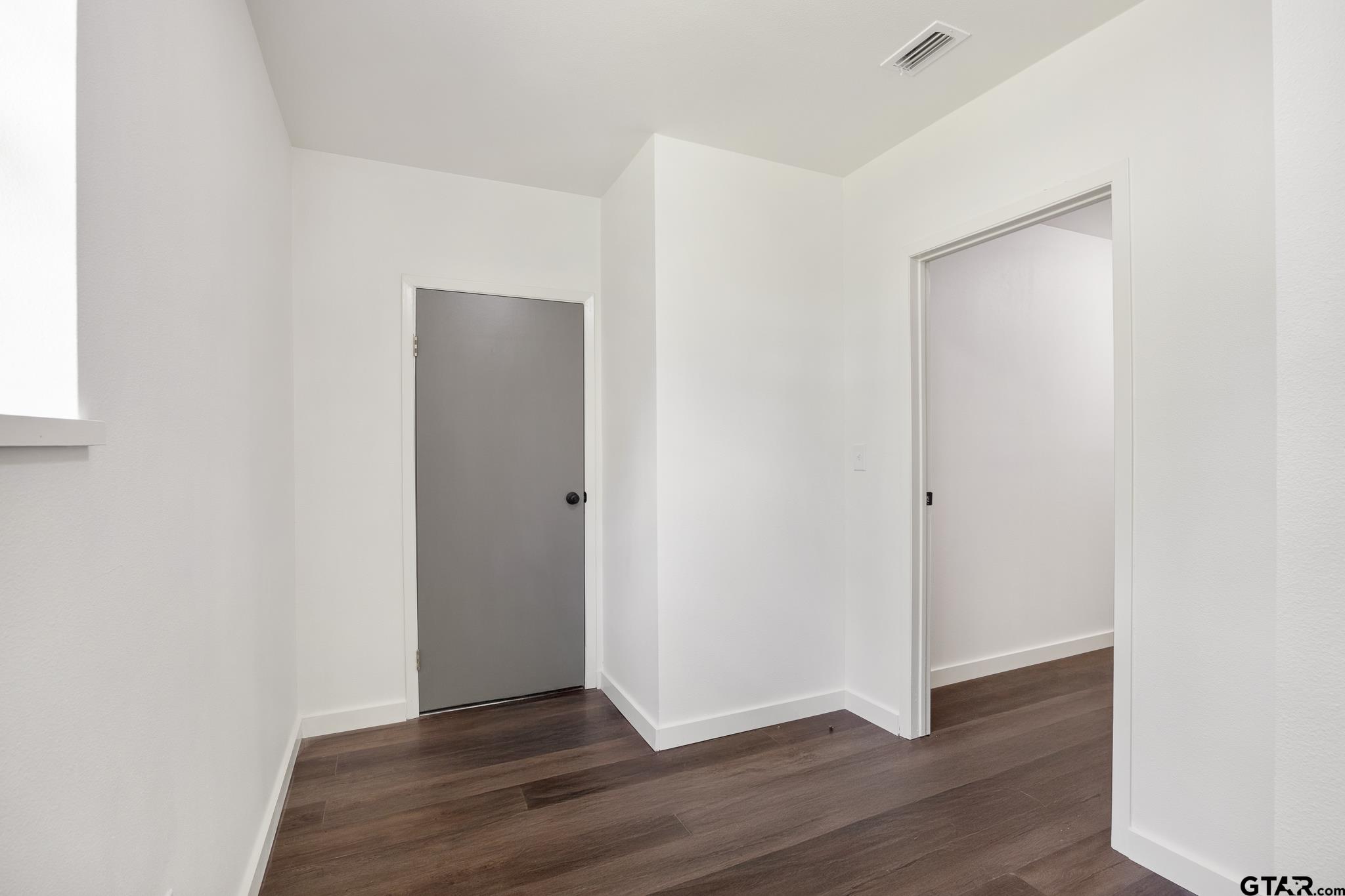 1538 North Hill Road Tyler, TX 75702 - Photo 17 of 29 a view of an empty room with wooden floor