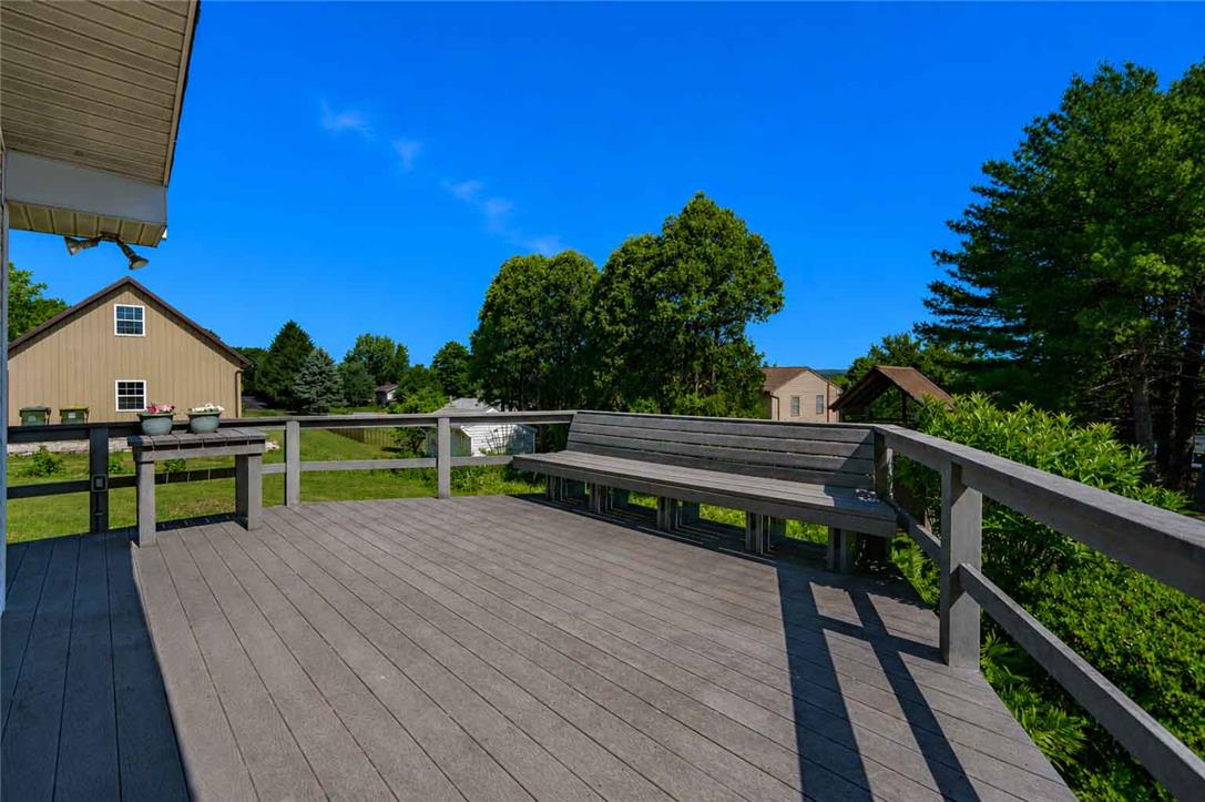 4815 Mill Road Schnecksville, PA 18078 - Photo 41 of 48 A spacious wooden deck provides ample outdoor living space, perfect for relaxing or entertaining.