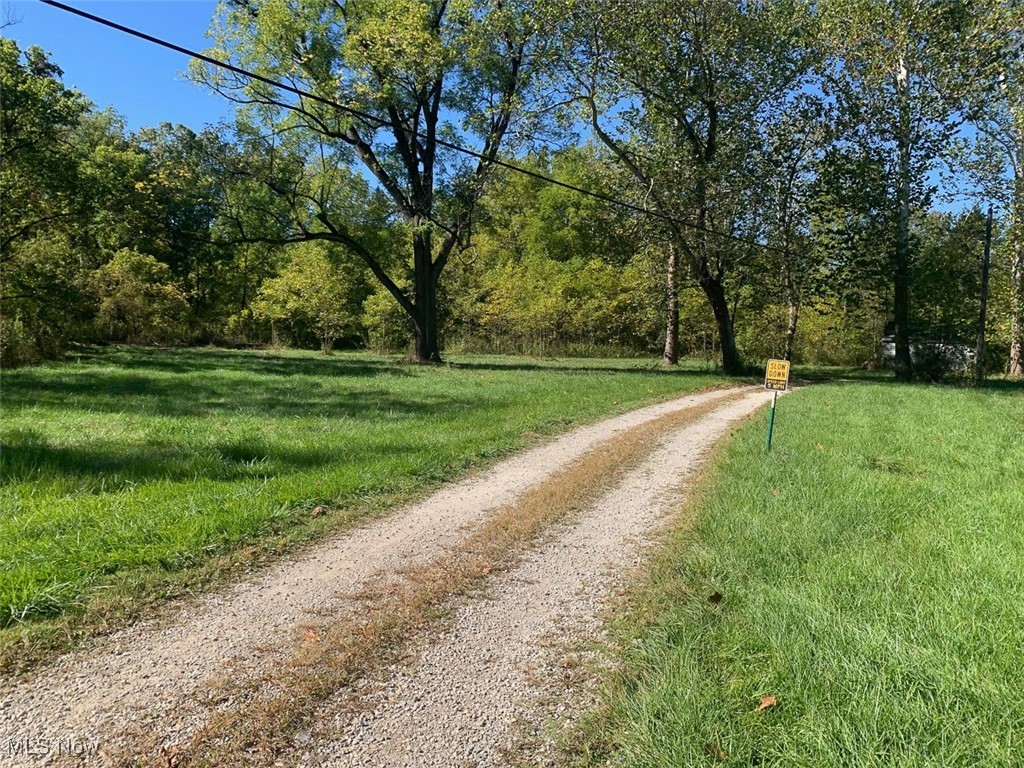 19345 Ridge Road North Royalton, OH 44133 - Photo 21 of 47 View of dirt / gravel road featuring a wooded view