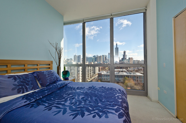 1201 West Adams Street, Unit 905 Chicago, IL 60607 - Photo 14 of 19 a bedroom with a large bed and a large window