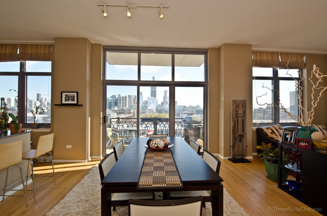 1201 West Adams Street, Unit 905 Chicago, IL 60607 - Photo 6 of 19 a living room with furniture and floor to ceiling windows