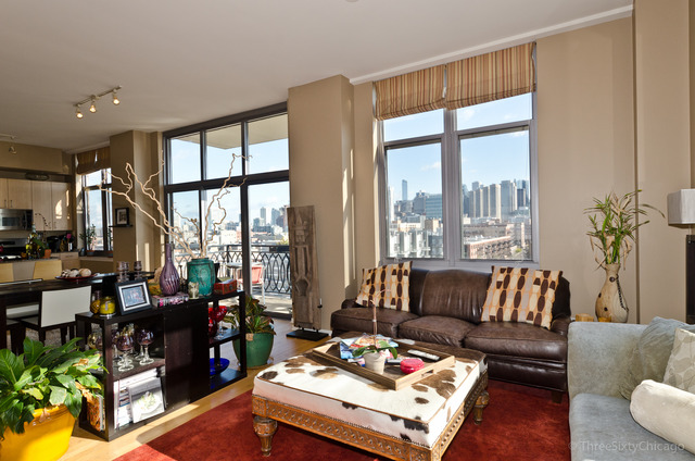 1201 West Adams Street, Unit 905 Chicago, IL 60607 - Photo 9 of 19 a living room with furniture and a large window