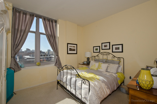 1201 West Adams Street, Unit 905 Chicago, IL 60607 - Photo 10 of 19 a bedroom with a bed and a large window