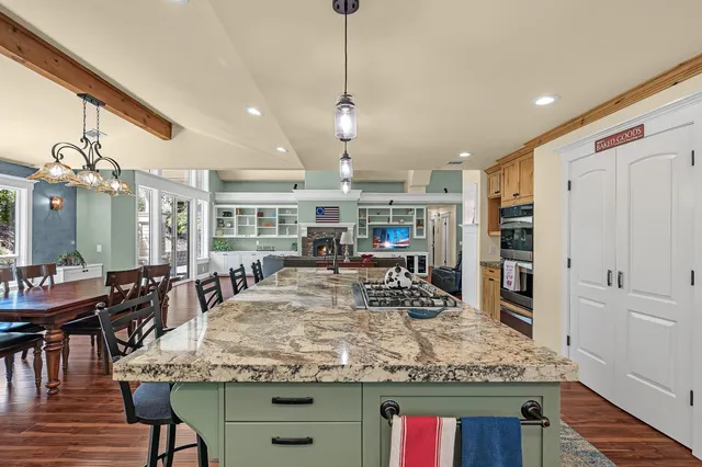 a view of walk in closet with clothes