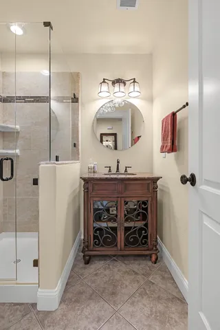 a bedroom with a bed and a view of bathroom