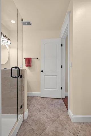 a bathroom with a toilet a sink and a mirror