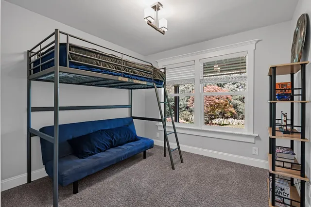 a backyard of a house with yard and outdoor seating