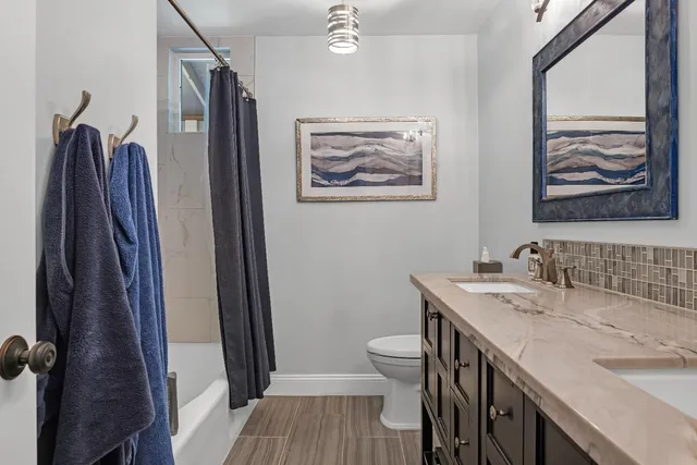 a view of a backyard with large trees