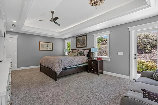 a view of a porch with chairs and backyard