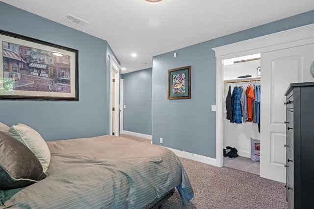 an aerial view of a house with a yard and trees