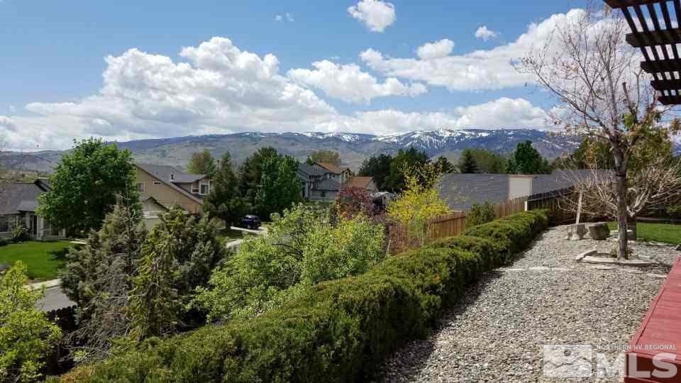 1620 Catherine Way Reno, NV 89523 - Photo 15 of 17 a view of a garden with plants and a bench