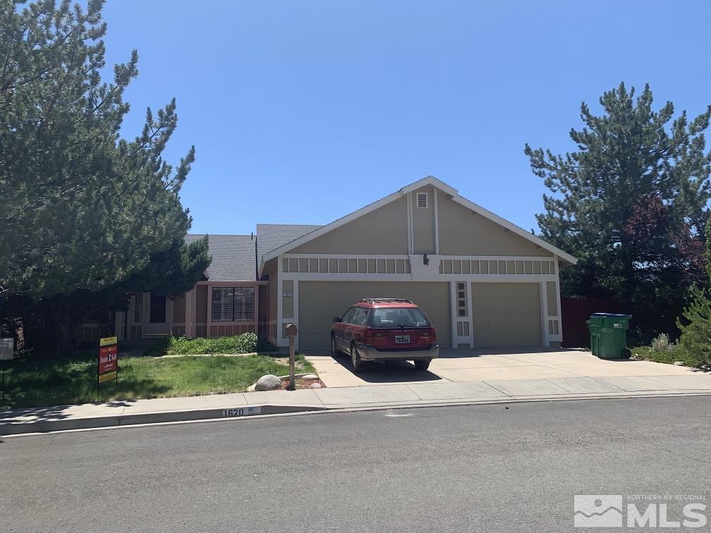 1620 Catherine Way Reno, NV 89523 - Photo 3 of 17 a front view of a house with a yard and garage