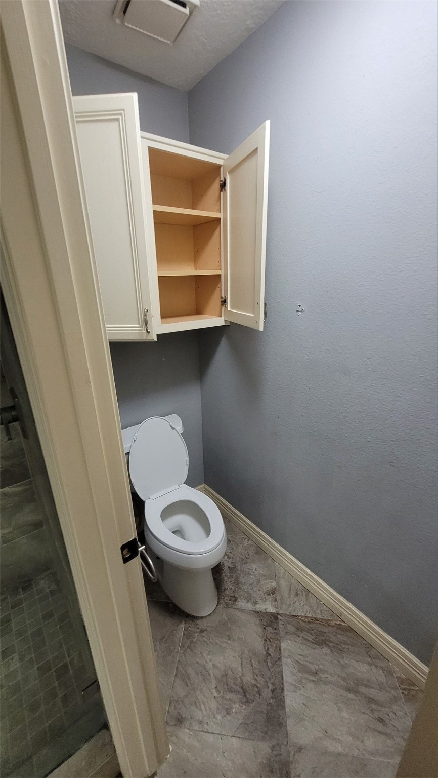 13307 Lynnville Drive Houston, TX 77065 - Photo 6 of 9 a bathroom with a toilet