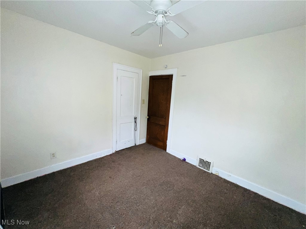 968 Whitby Road Cleveland Heights, OH 44112 - Photo 9 of 19 Spare room featuring carpet flooring and ceiling fan