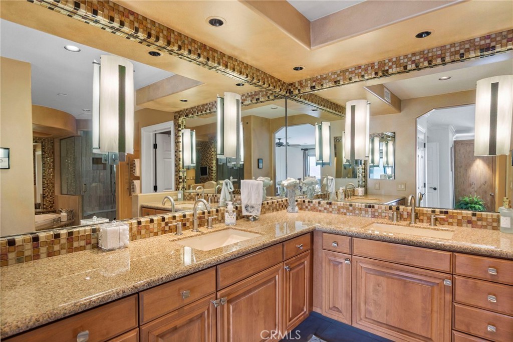 34403 Street Of The Green Lantern, Unit 2 Dana Point, CA 92629 - Photo 20 of 38 a bathroom with a granite countertop sink mirror and double