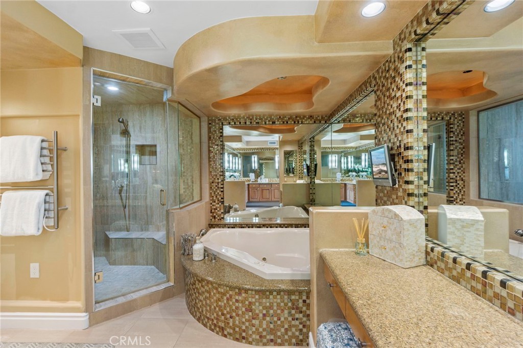 34403 Street Of The Green Lantern, Unit 2 Dana Point, CA 92629 - Photo 21 of 38 a large living room with a large tub and chandelier