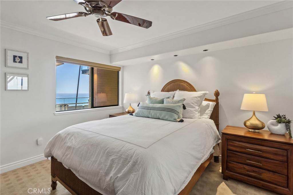 34403 Street Of The Green Lantern, Unit 2 Dana Point, CA 92629 - Photo 26 of 38 a bedroom with a bed and window