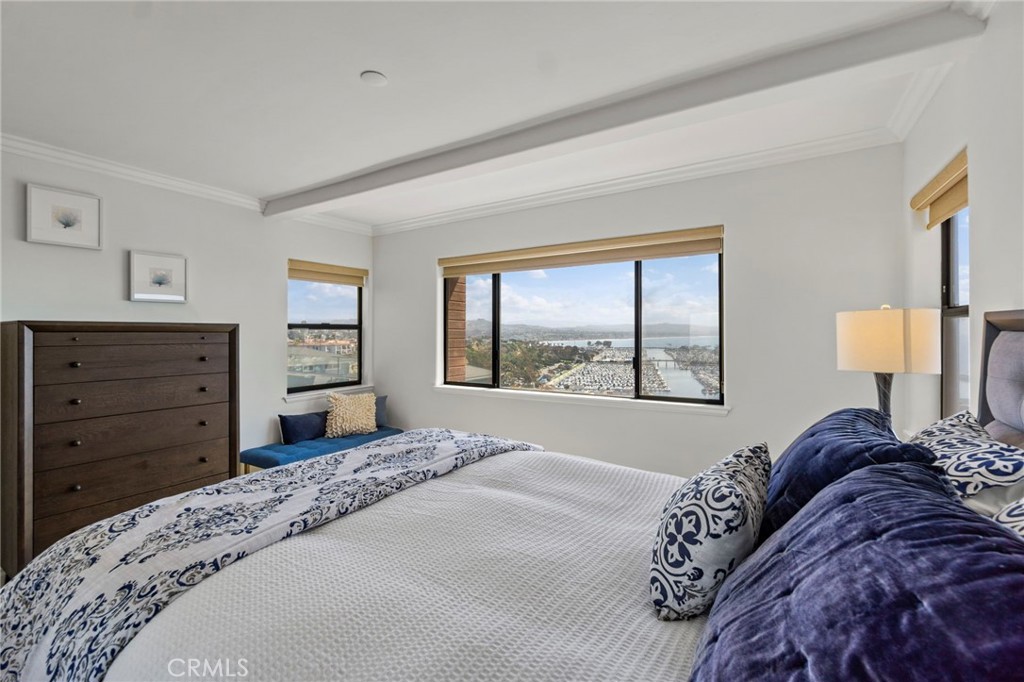 34403 Street Of The Green Lantern, Unit 2 Dana Point, CA 92629 - Photo 28 of 38 a bedroom with a bed and a window