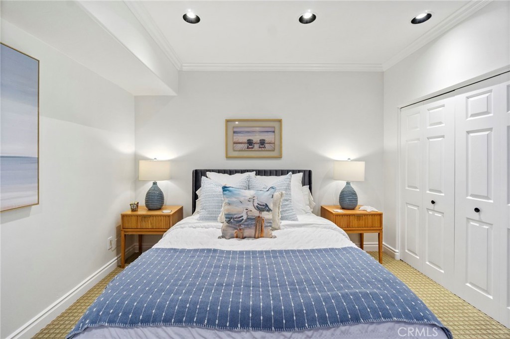 34403 Street Of The Green Lantern, Unit 2 Dana Point, CA 92629 - Photo 30 of 38 a bedroom with a bed and wooden floor