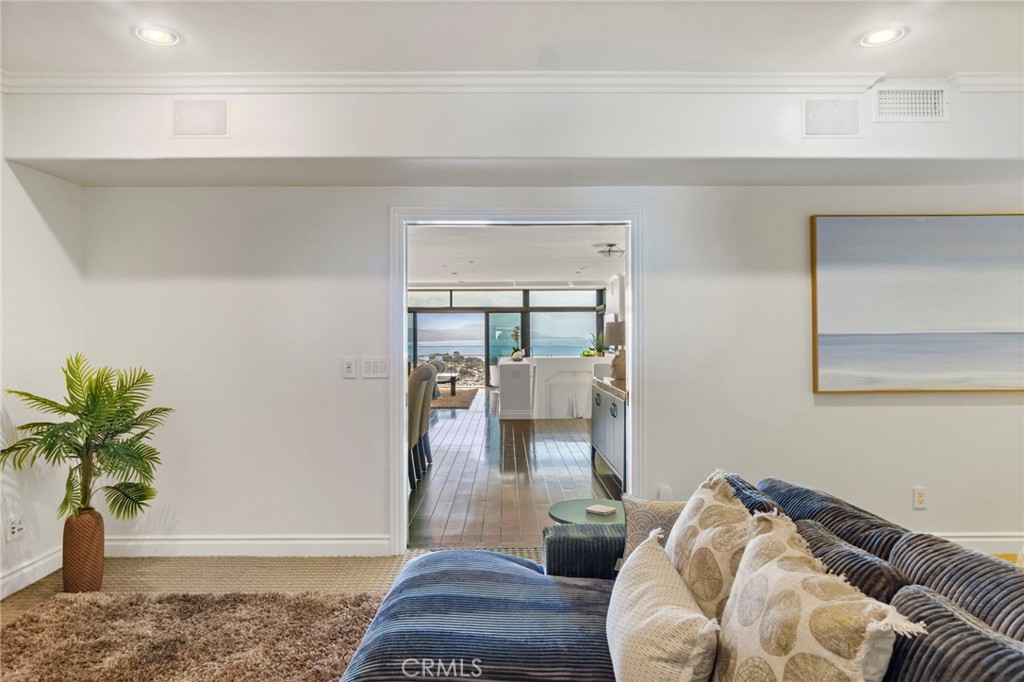 34403 Street Of The Green Lantern, Unit 2 Dana Point, CA 92629 - Photo 31 of 38 a living room with furniture and wooden floor
