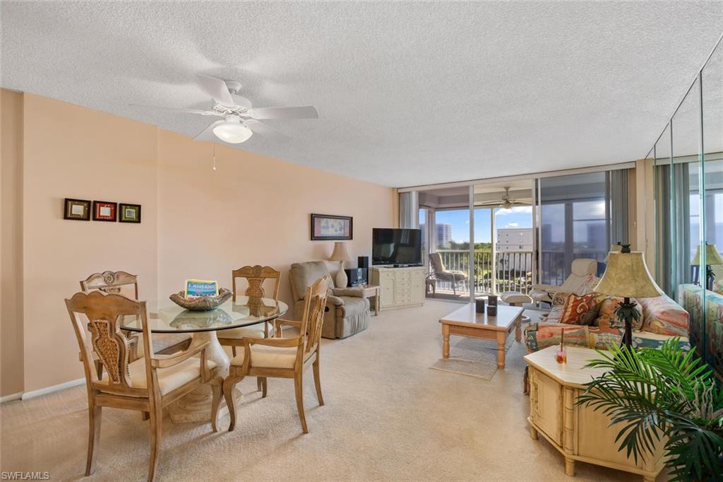 3 Bluebill Avenue, Unit 610 Naples, FL 34108 - Photo 3 of 15 a living room with furniture and a large window