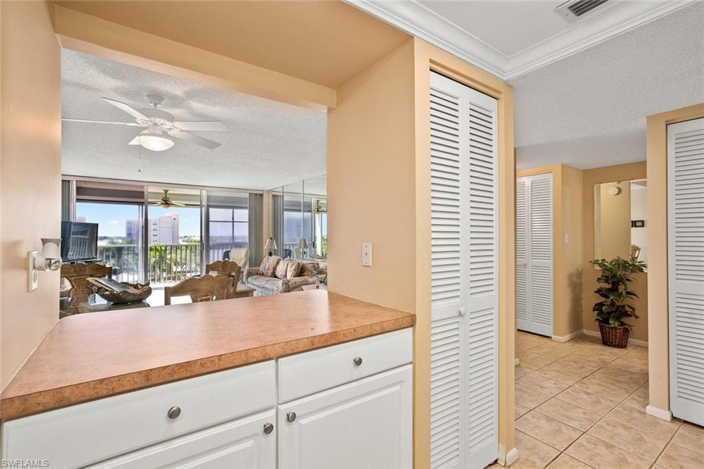 3 Bluebill Avenue, Unit 610 Naples, FL 34108 - Photo 7 of 15 a view of living room with furniture and large windows