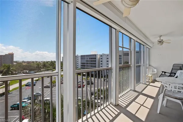 a view of a balcony with wooden floor
