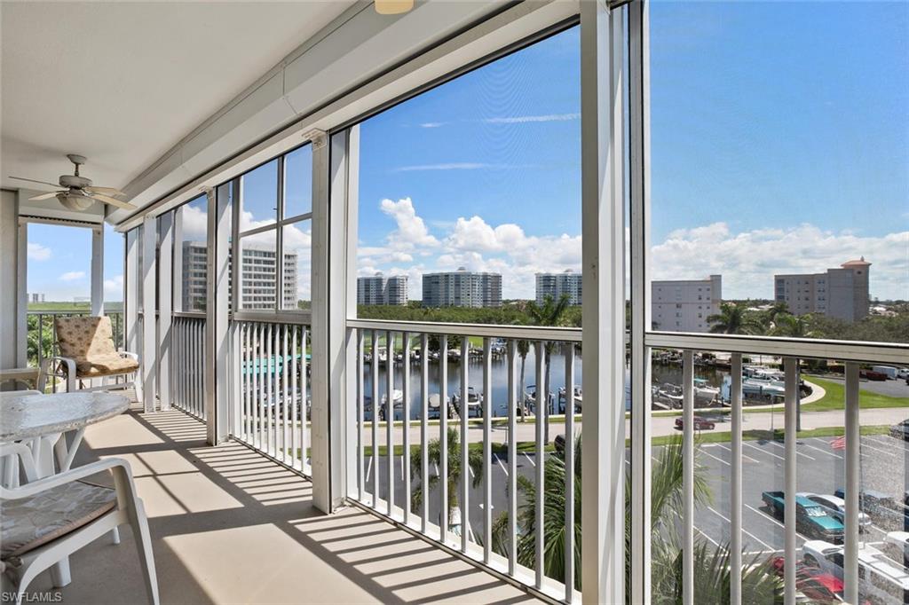 3 Bluebill Avenue, Unit 610 Naples, FL 34108 - Photo 10 of 15 a view of a balcony with wooden floor