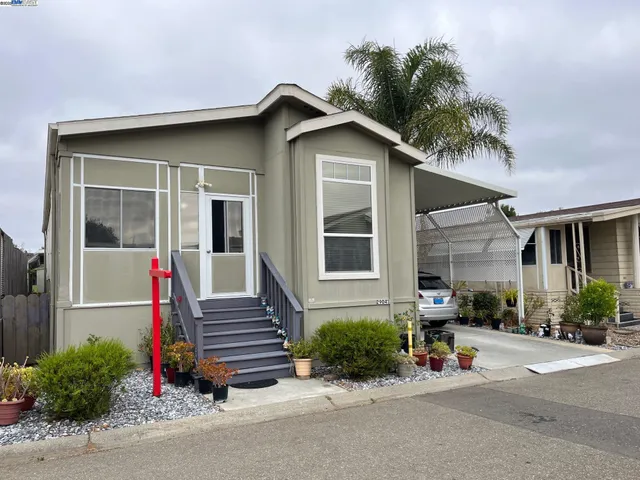 a view of a house with entrance and plants