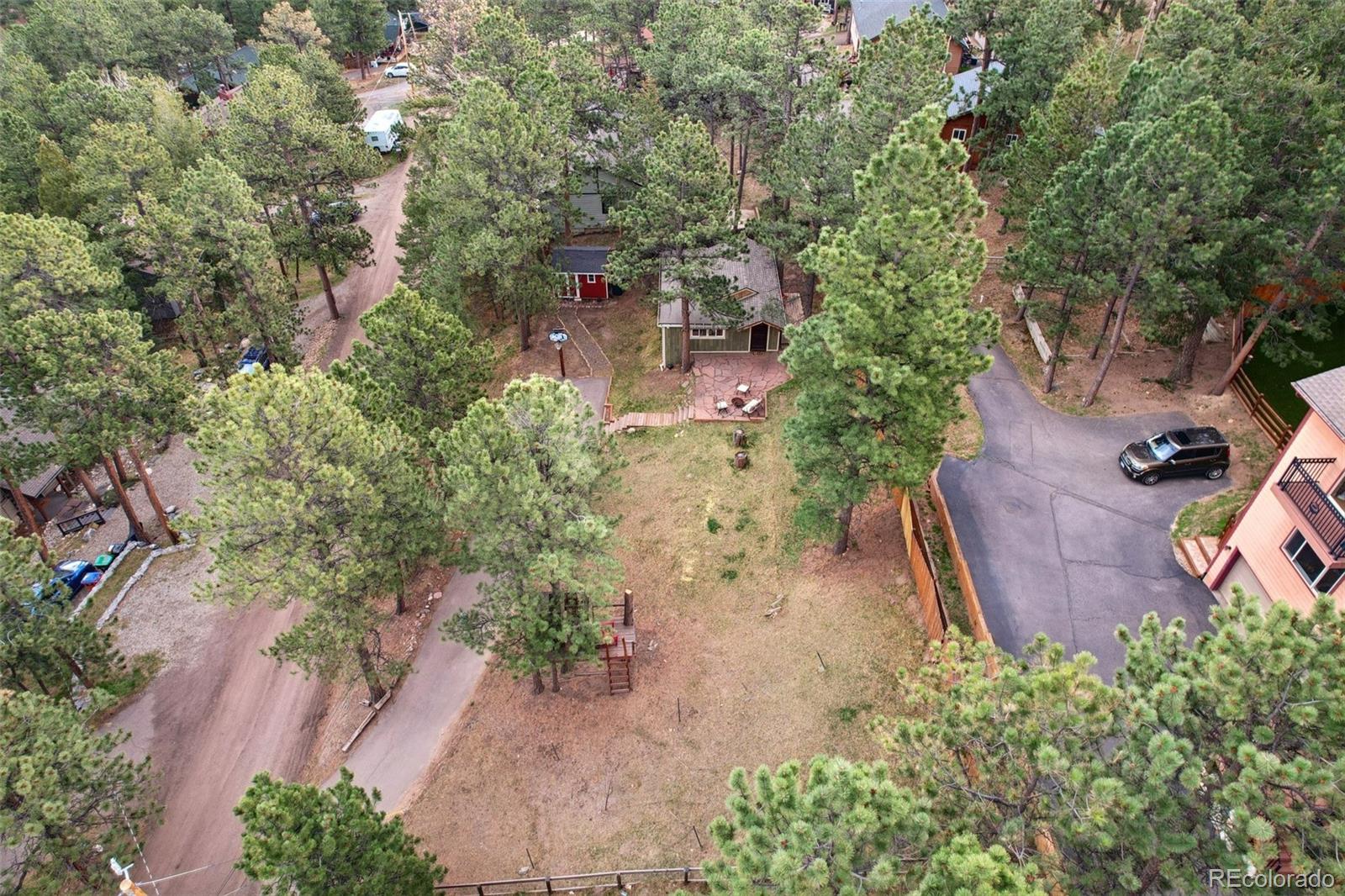 29772 Spruce Road Evergreen, CO 80439 - Photo 5 of 9 an aerial view of a house with a yard
