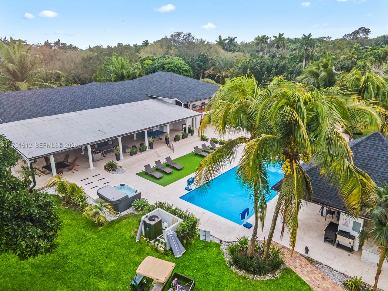 14875 Southwest 212th Street Miami, FL 33187 - Photo 12 of 80 an aerial view of a house with a yard
