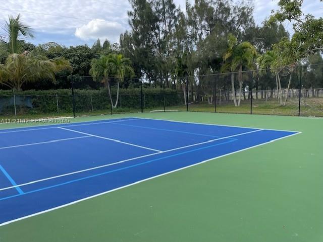 14875 Southwest 212th Street Miami, FL 33187 - Photo 25 of 80 a view of tennis court with trees in the background