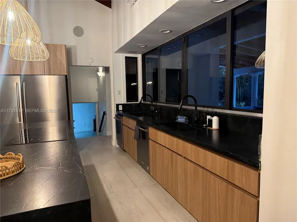 a bathroom with a sink and a washing machine