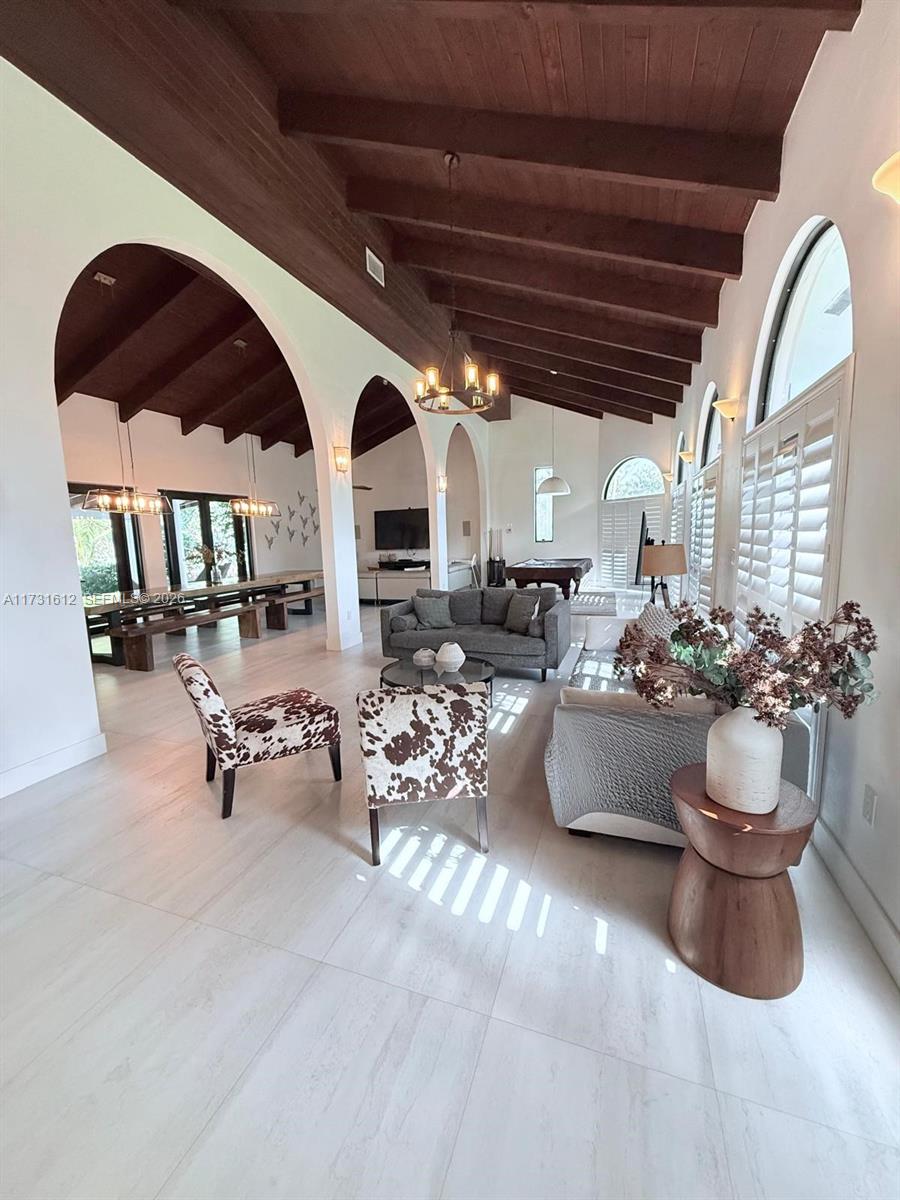 14875 Southwest 212th Street Miami, FL 33187 - Photo 53 of 80 a living room with lots of furniture and a large window