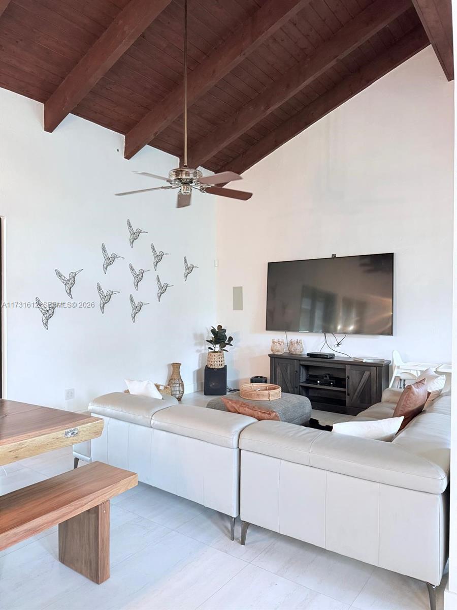 14875 Southwest 212th Street Miami, FL 33187 - Photo 55 of 80 a living room with furniture and a flat screen tv