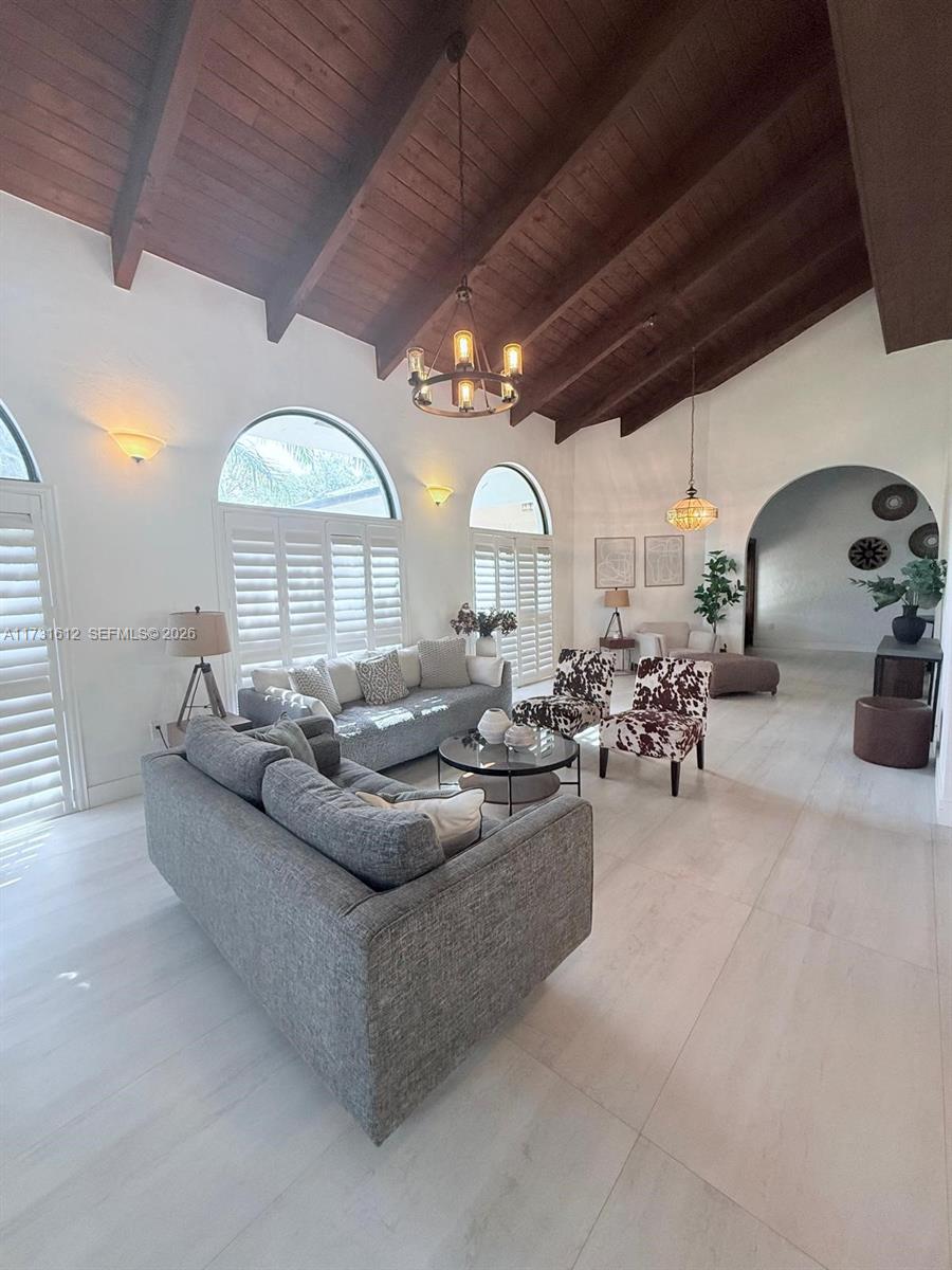 14875 Southwest 212th Street Miami, FL 33187 - Photo 58 of 80 a living room with lots of furniture and a large window