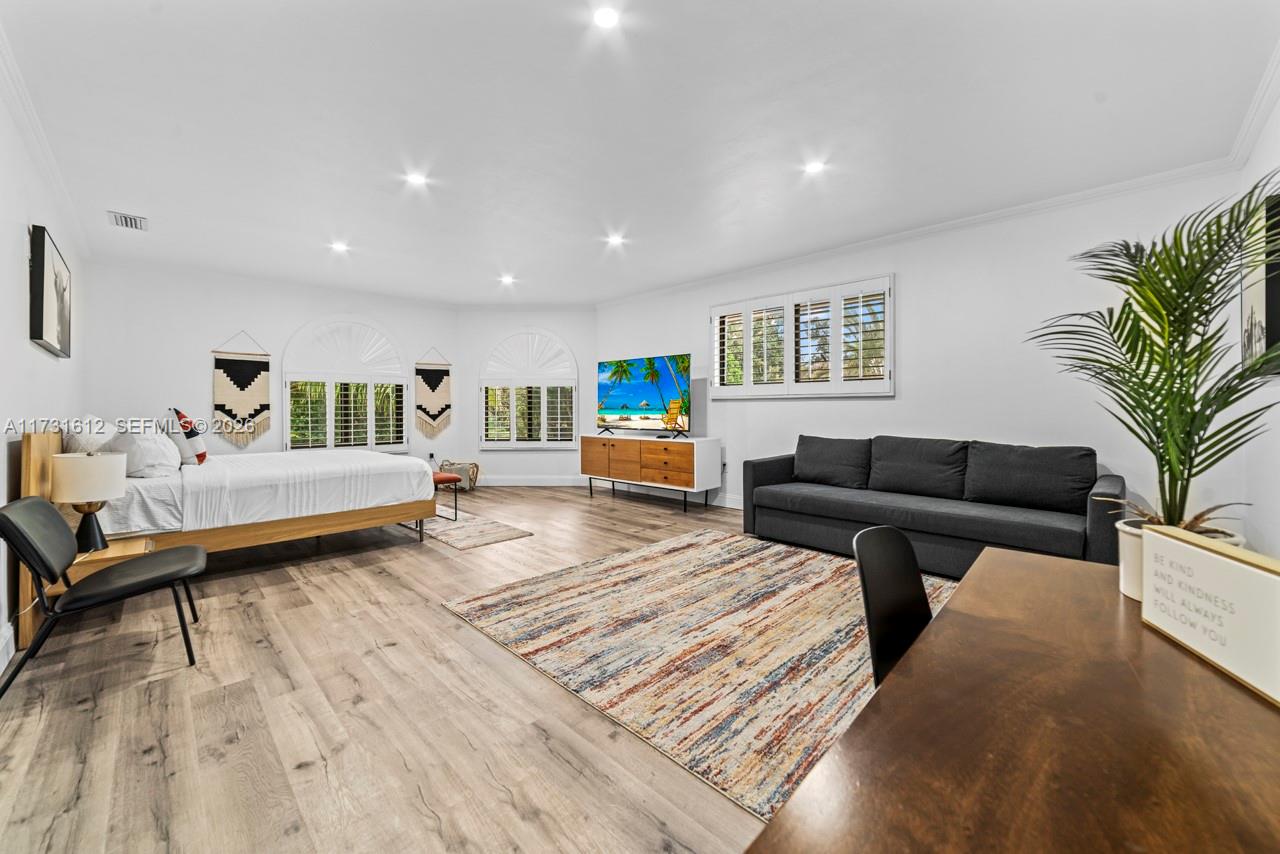 14875 Southwest 212th Street Miami, FL 33187 - Photo 73 of 80 a living room with furniture and a wooden floor
