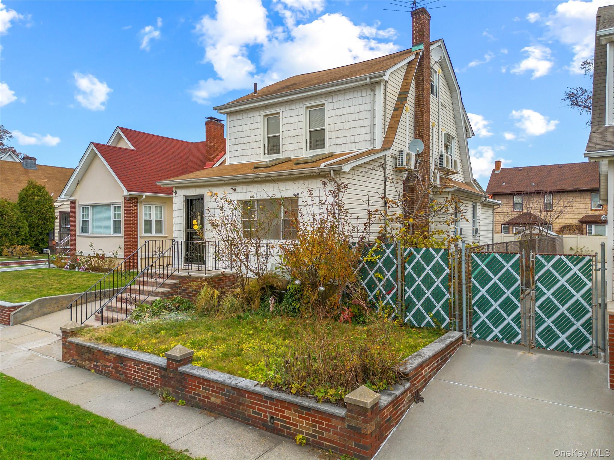 42-25 189th Street Queens, NY 11358 - Photo 1 of 25 a front view of a house with porch