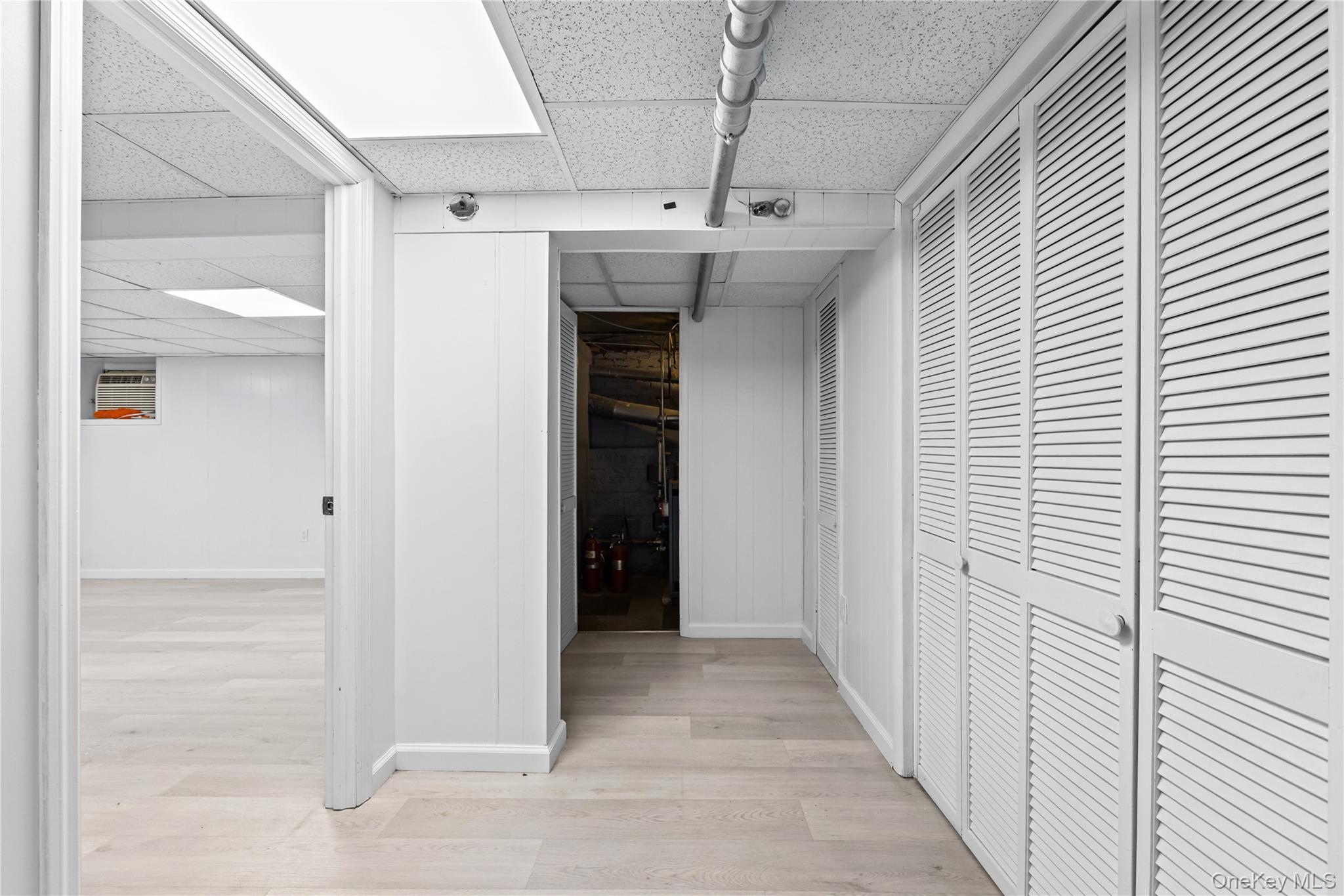 42-25 189th Street Queens, NY 11358 - Photo 20 of 25 a view of a hallway with wooden shelves