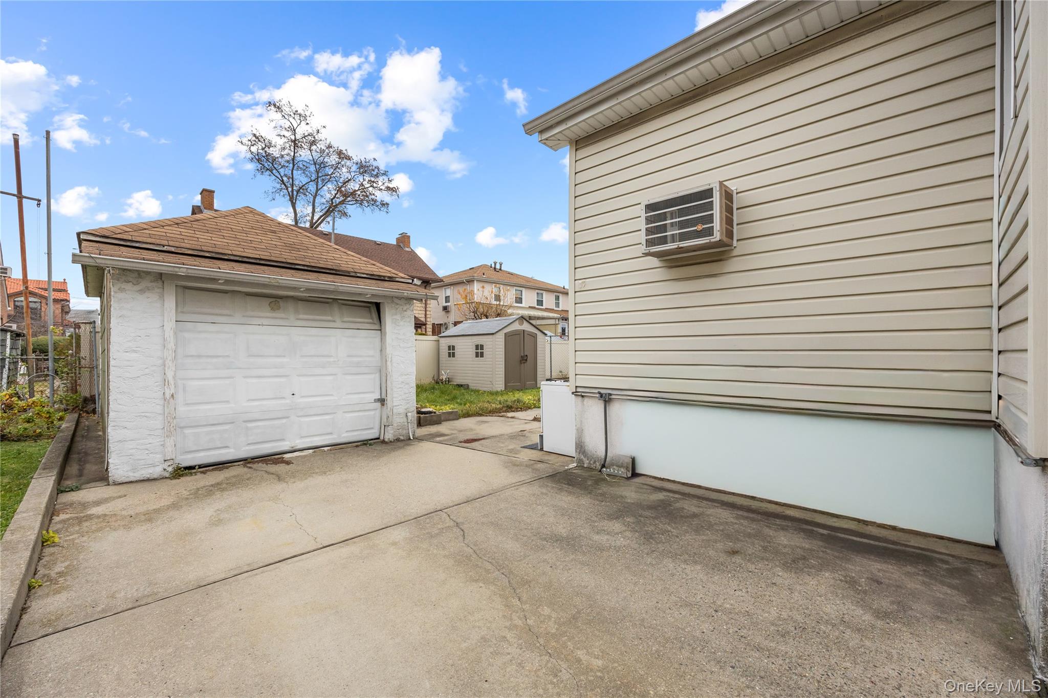 42-25 189th Street Queens, NY 11358 - Photo 24 of 25 a view of a house with a garage
