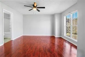wooden floor in an empty room with a window