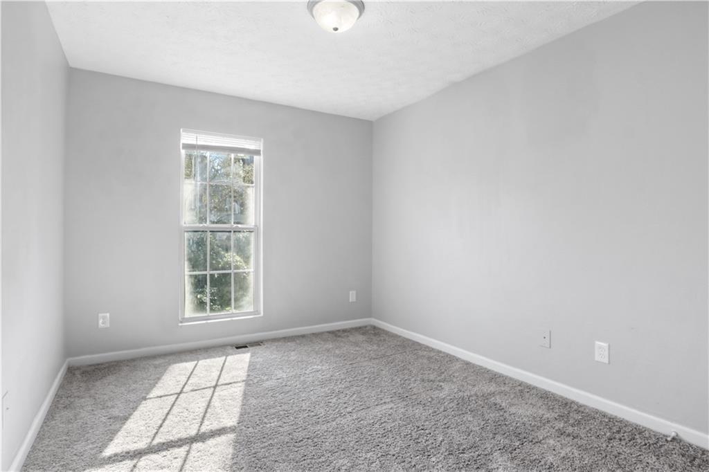 3882 Waldrop Lane Decatur, GA 30034 - Photo 8 of 11 an empty room with windows