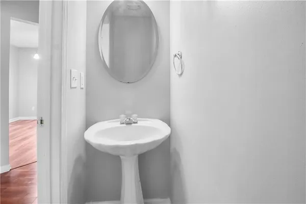 a bathroom with a sink a mirror and a toilet