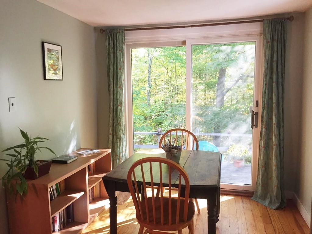 24 Mill Road Harvard, MA 01451 - Photo 8 of 26 a view of a dining room with furniture window and wooden floor