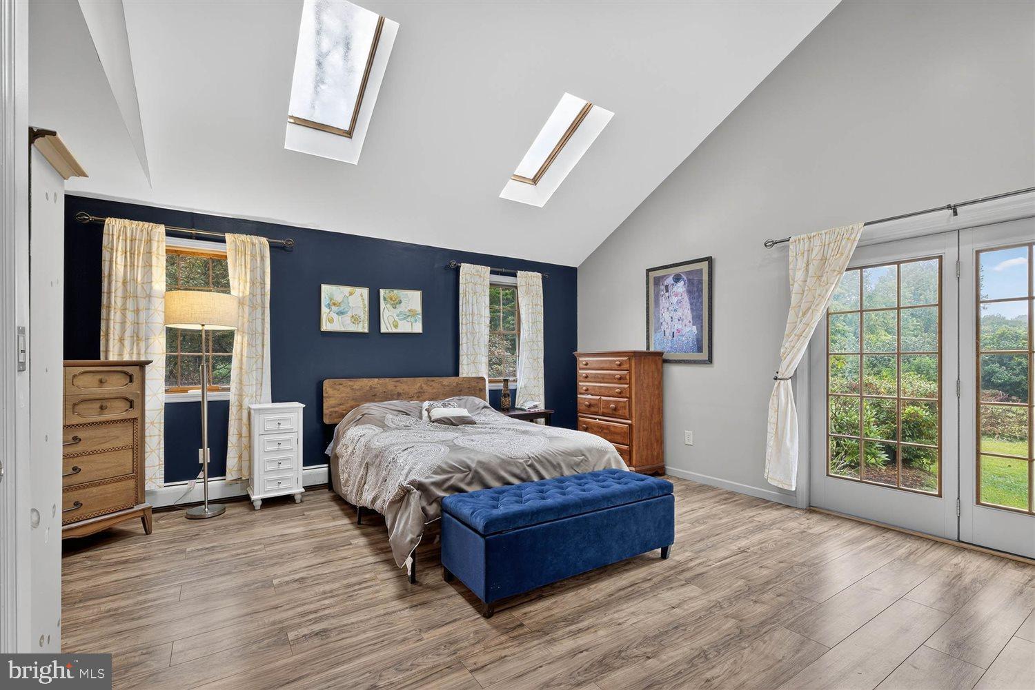 5987 River Road Conestoga, PA 17516 - Photo 21 of 40 a bed sitting in a spacious bedroom next to a window