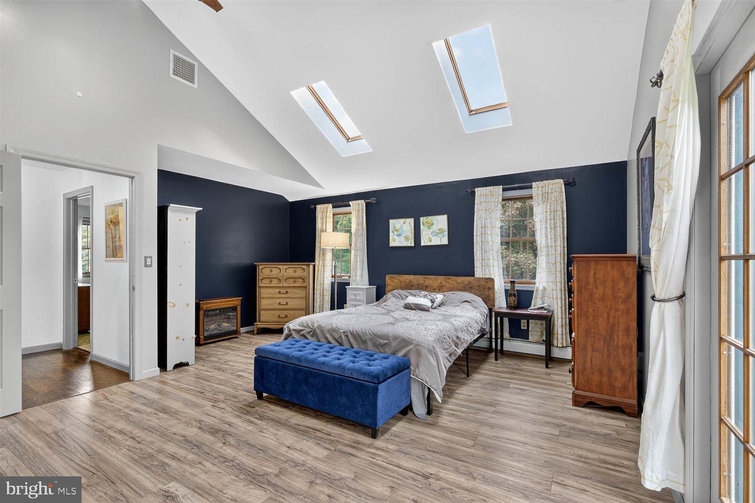 5987 River Road Conestoga, PA 17516 - Photo 22 of 40 a bedroom with a large bed couch and a window