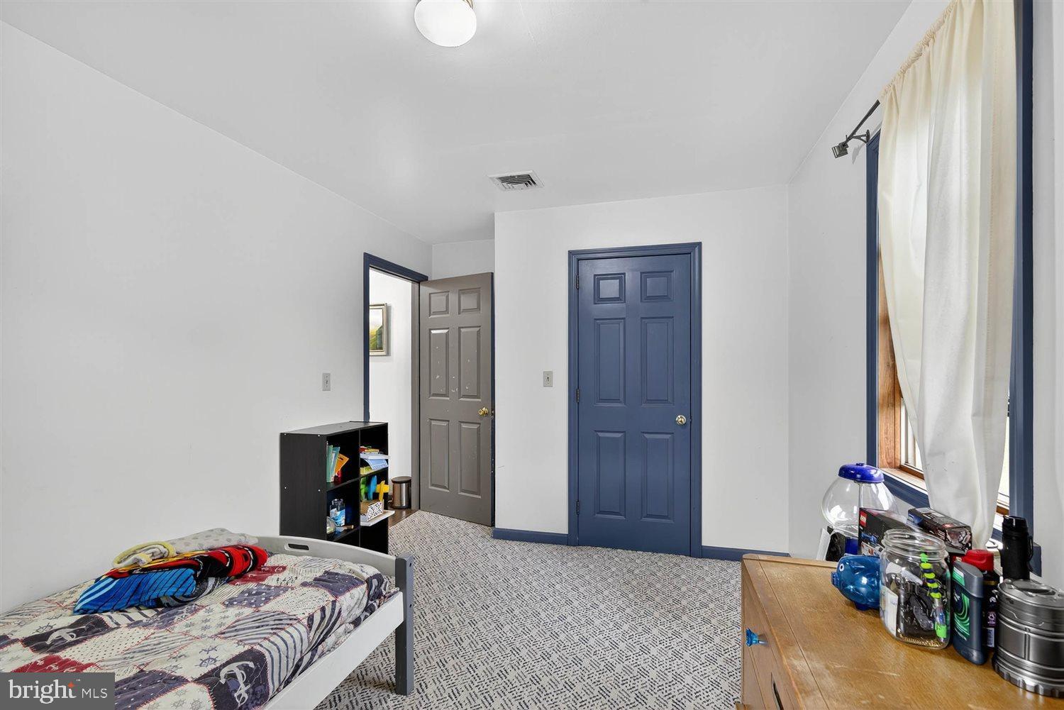 5987 River Road Conestoga, PA 17516 - Photo 28 of 40 a bedroom with bed and a window