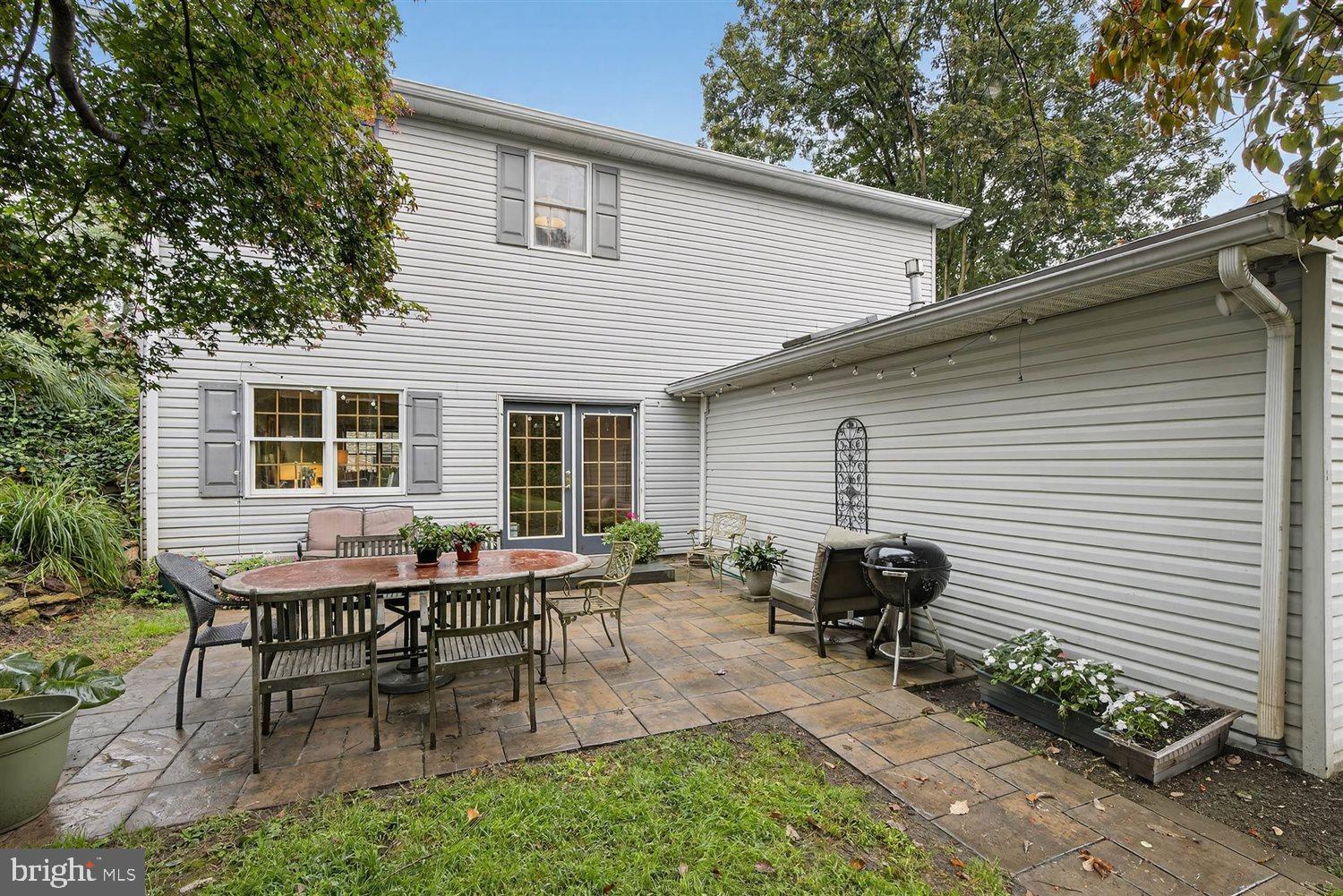 5987 River Road Conestoga, PA 17516 - Photo 31 of 40 a backyard of a house with table and chairs