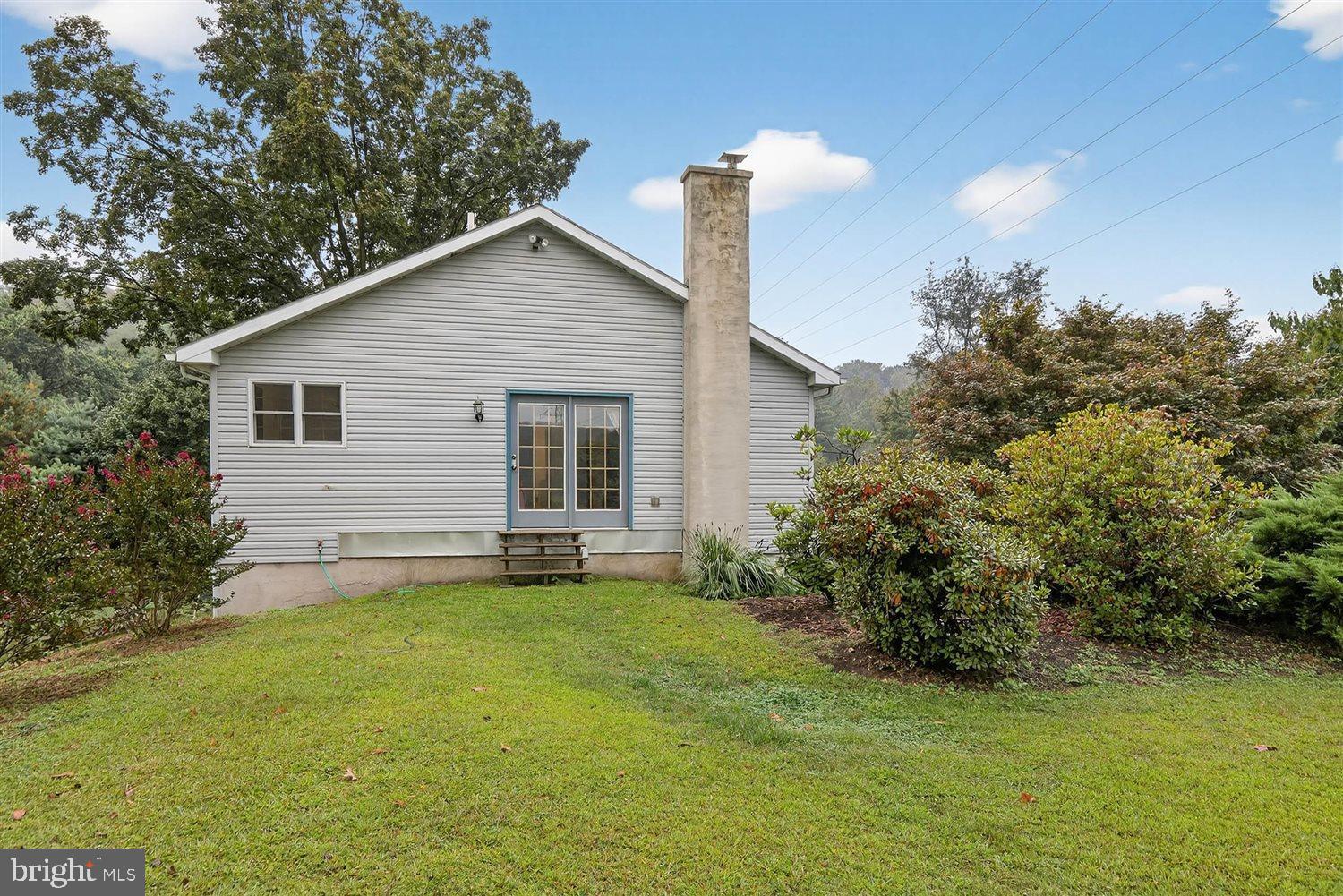 5987 River Road Conestoga, PA 17516 - Photo 33 of 40 a view of a backyard with a garden and plants